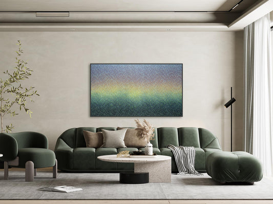 Modern living room with a green sofa, coffee table, and abstract wall art.