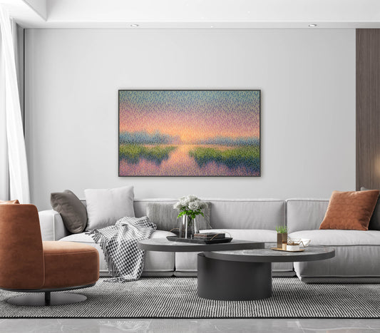 Modern living room with a large original painting a nature scene, gray sofa, and brown armchair.