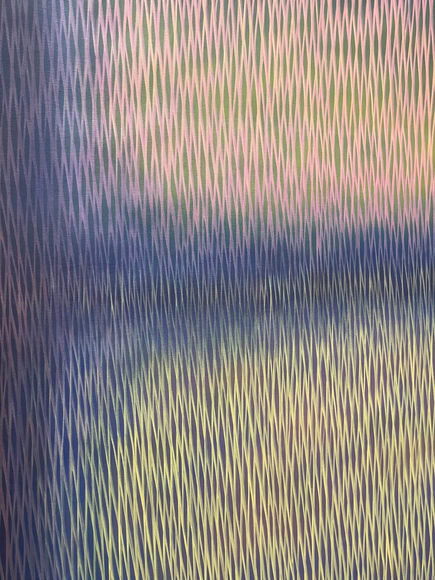 Abstract pattern with wavy lines in blue, green, and purple tones.