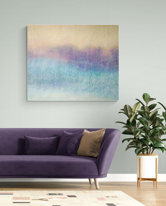 Purple sofa with decorative pillows in a room with a colorful abstract painting on the wall.