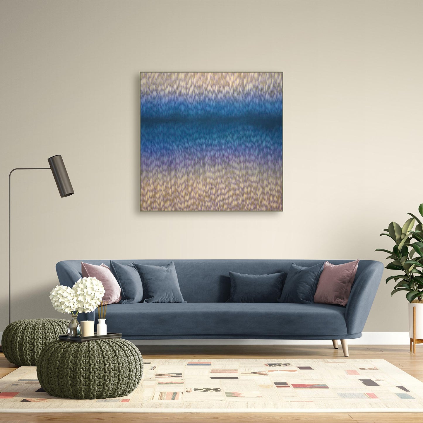 Modern living room with a painting of a landscape on the wall, a white console table, and decorative plants.