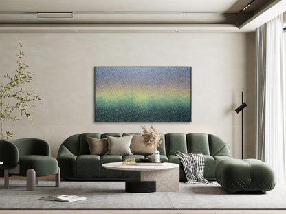 Modern living room with a green sofa, coffee table, and abstract wall art.