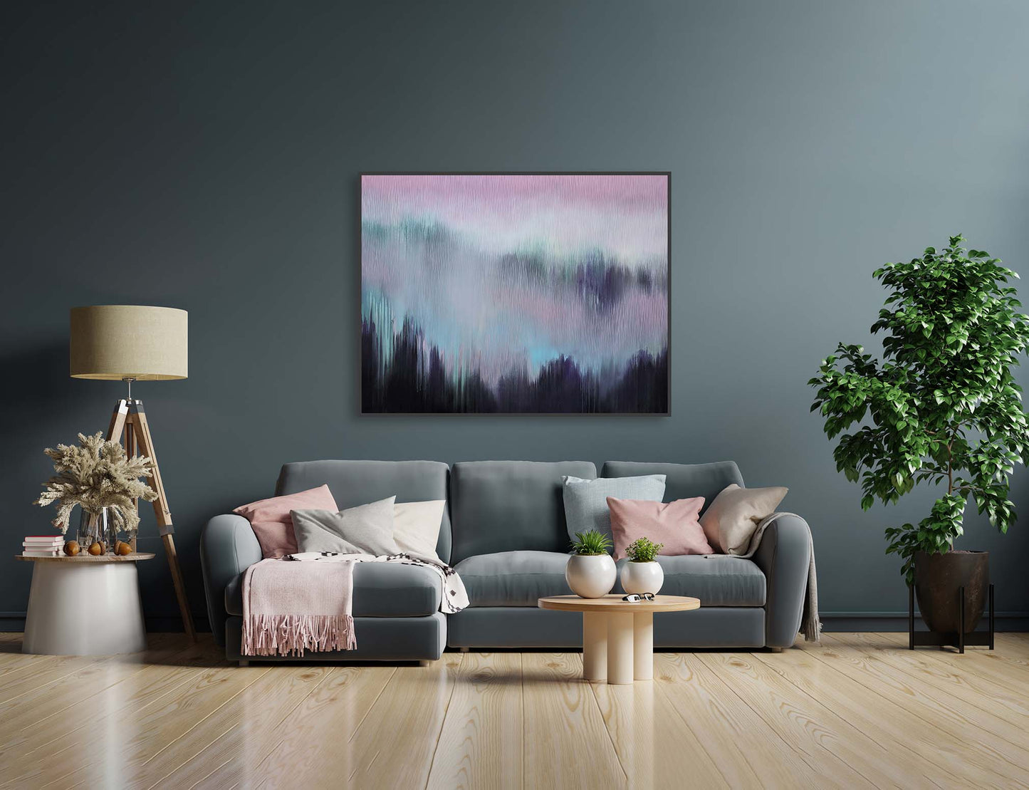 Modern living room with a gray sofa, abstract painting, and decorative items.