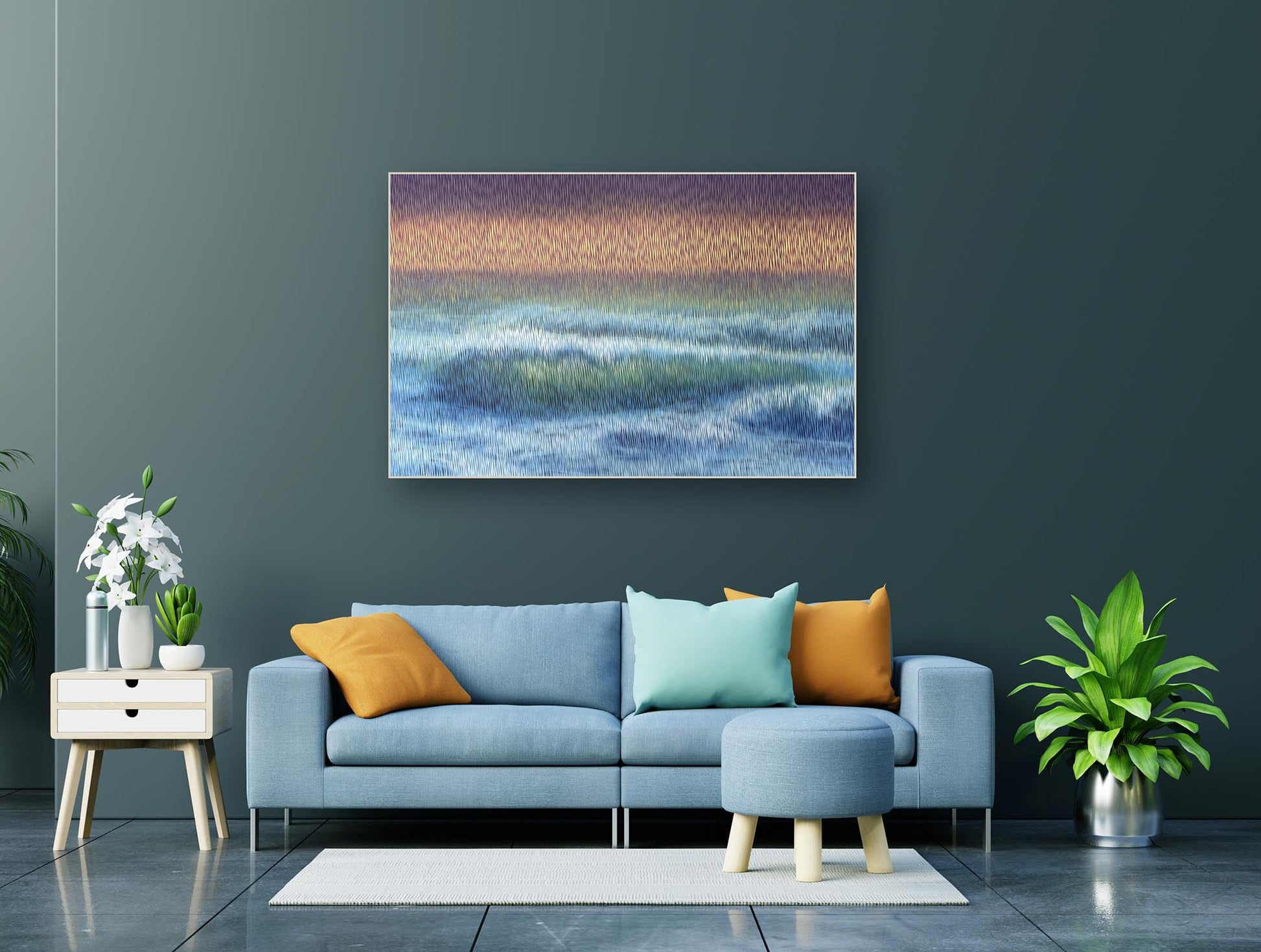 Modern living room with a blue sofa, colorful cushions, and a painting of a landscape on the wall.