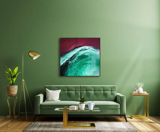 Modern living room with a green sofa, abstract painting, and decorative items.