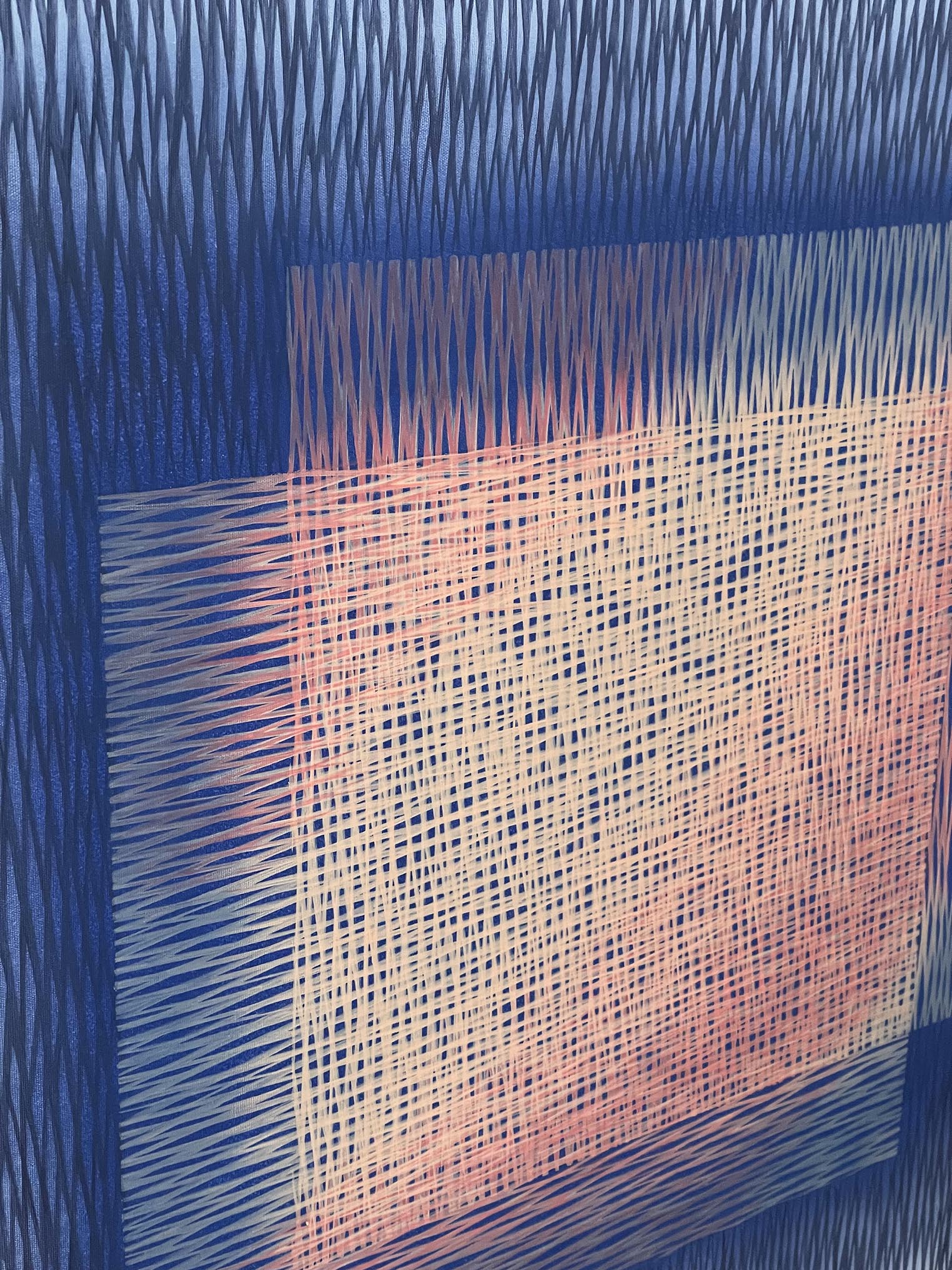 Close-up of a painting with blue and pink patterns