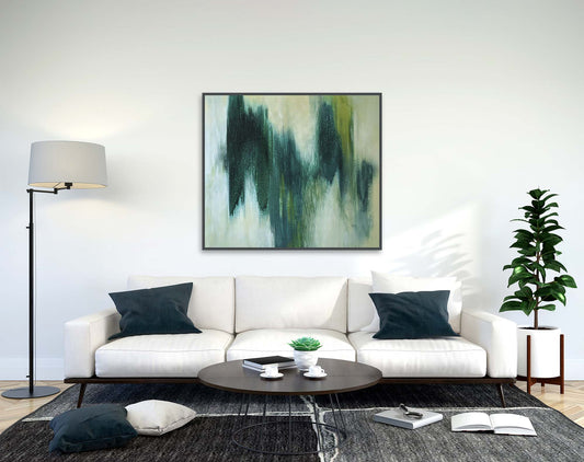 Modern living room with a white sofa, abstract painting, and decorative items.
