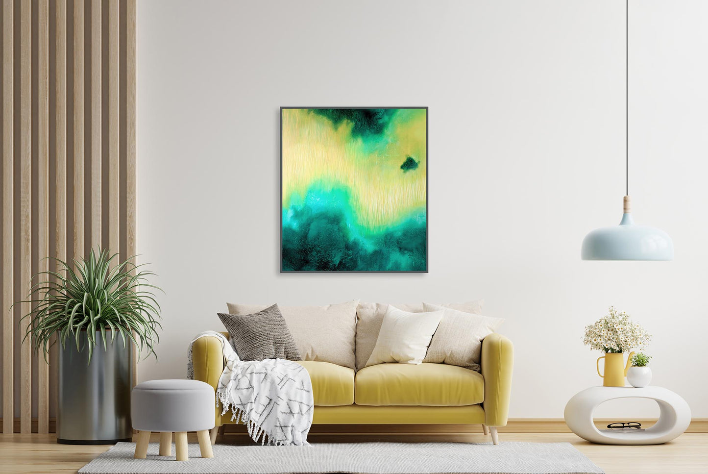 Living room with a yellow sofa, abstract art on the wall, and decorative elements.