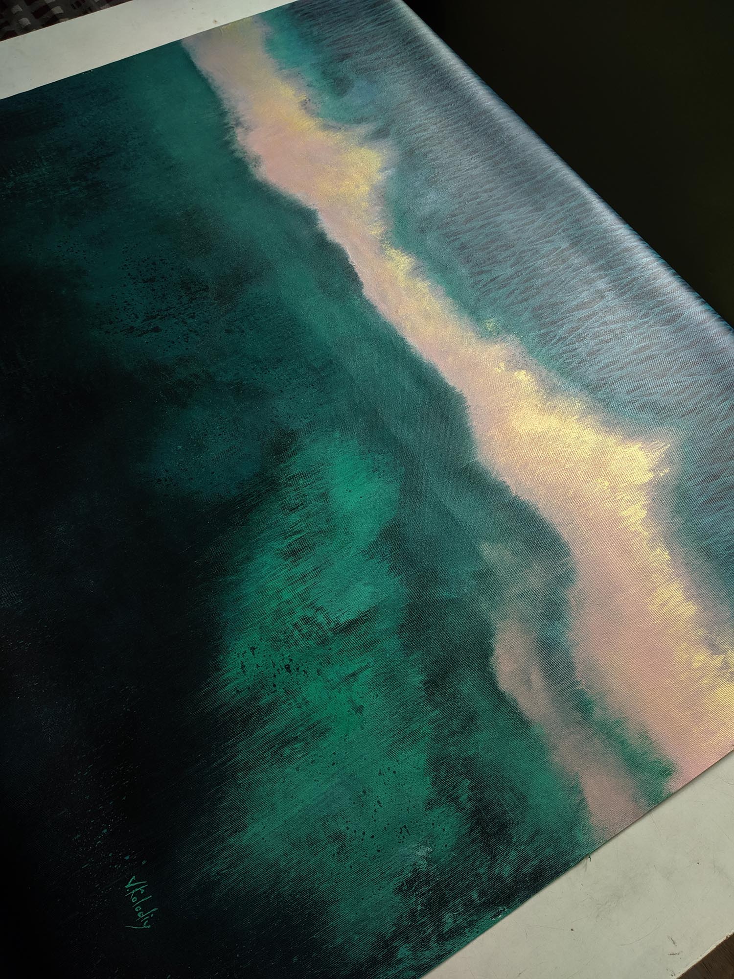 Abstract art with teal, pink, and black colors on a textured surface