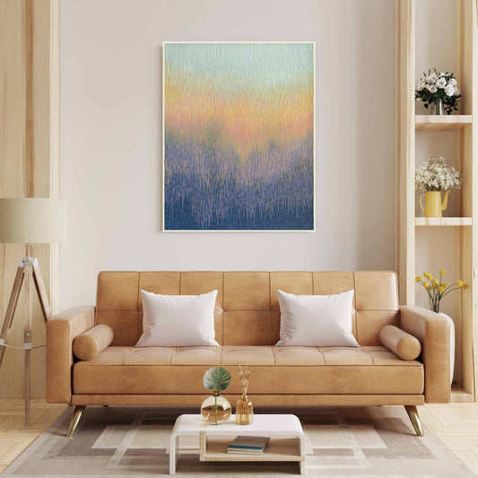 Modern living room with a tan sofa, abstract painting, and decorative items.