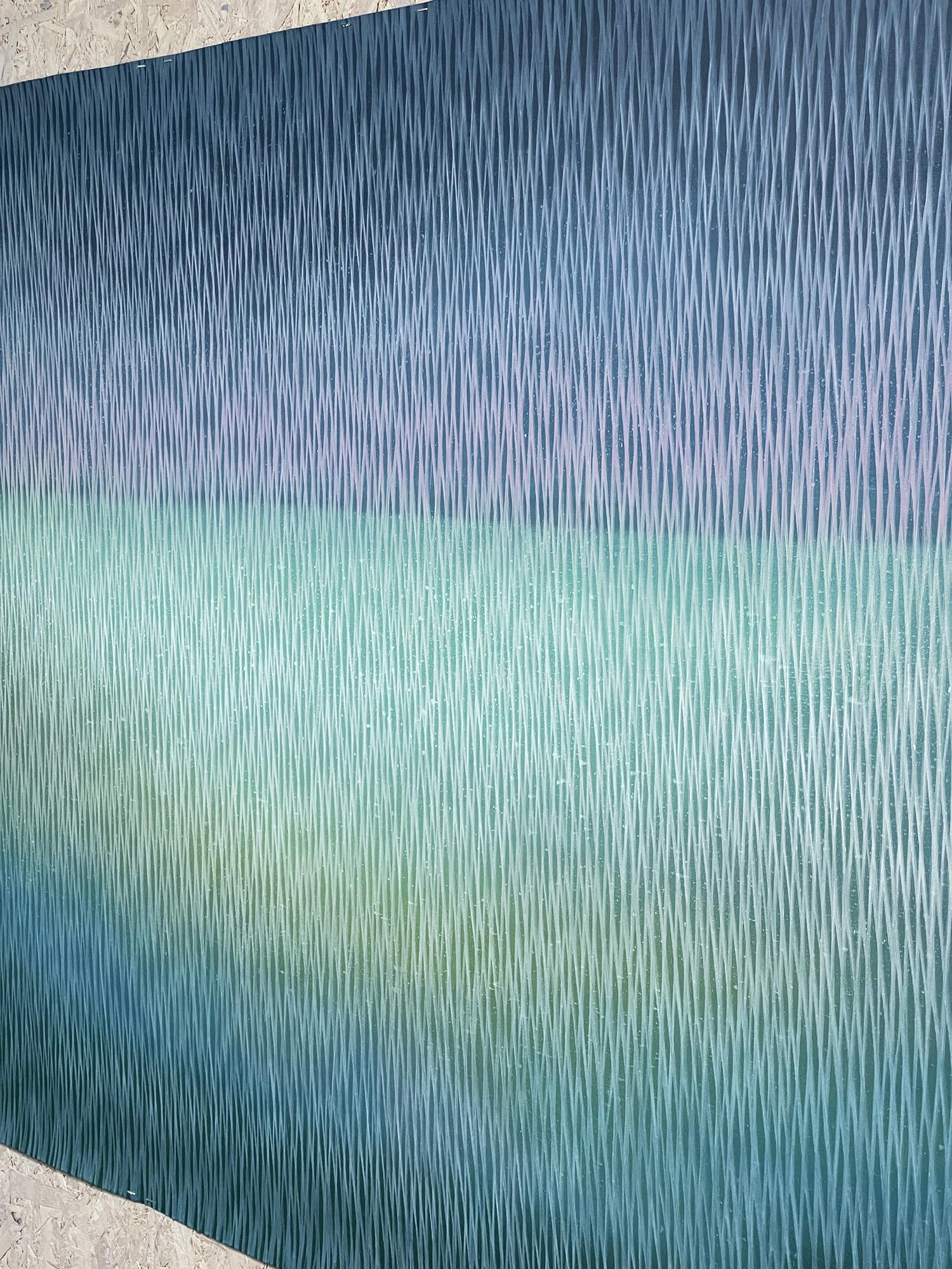 Textured blue and green surface with vertical lines